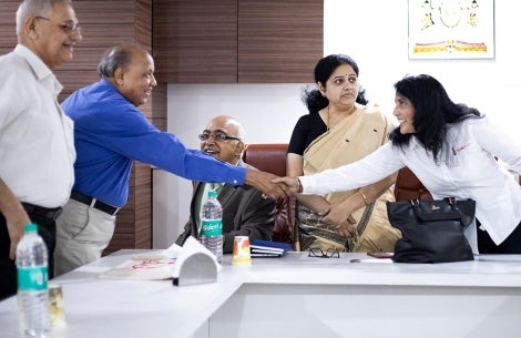 Mamta shaking hands with Smile Train partners